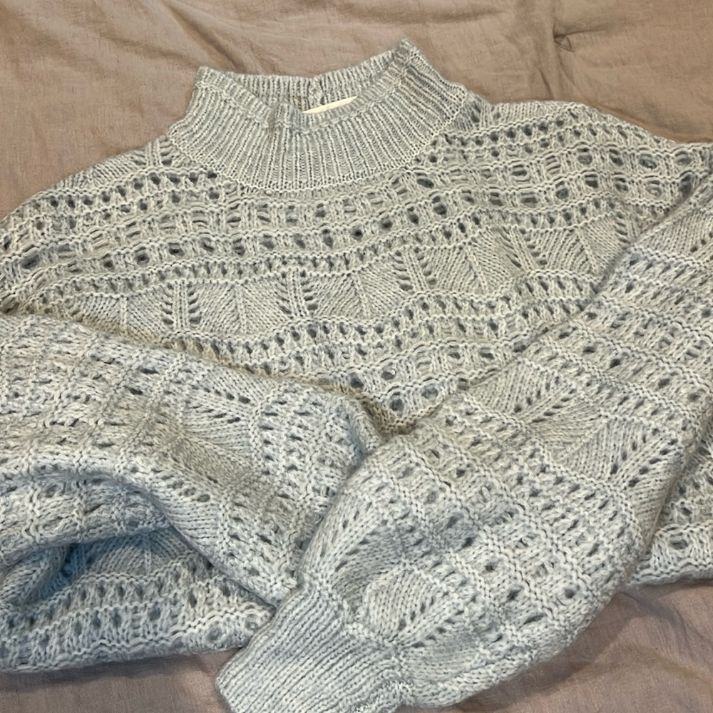 Knit sweater. Light blue color.